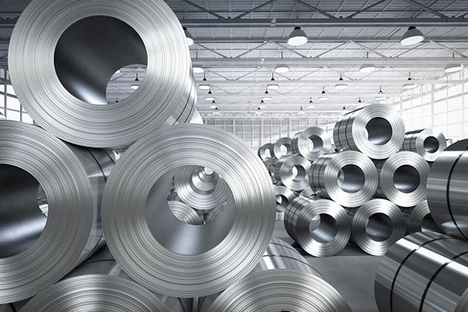 rolled sheets of steel stored in warehouse